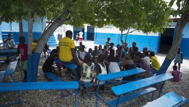 Children sitting at desks in Cité Soleil, Port au Prince, Haiti