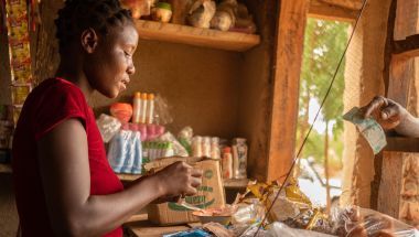 Eliza Manjolo, a beneficiary of Concern&#039;s &#039;Umodzi&#039; Graduation programme in her shop in Nsanje, Malawi, April 2021. Photo: Chris Gagnon / Concern Worldwide.