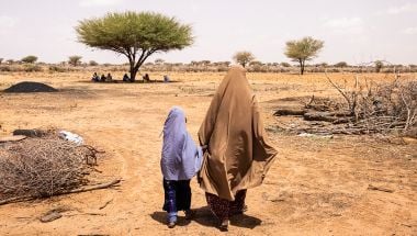 A Somali woman and her daughter inspect their field in Somaliland