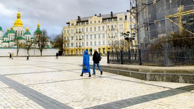 A couple walks through central Kyiv, February 2023