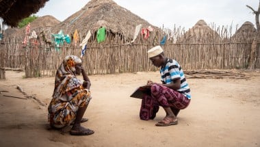 Hussein Mohamed (R), a community health volunteer, does a routine visit to Fatuma Adhan’s (L) house in Handaraku village in Tana River County, where she recently built a toilet. Photo: Lisa Murray/Zurich/Concern Worldwide