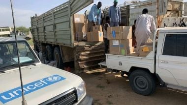 Staff unloading truck of medical supplies