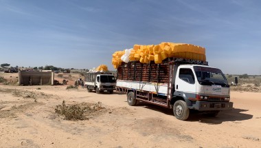 A truck carries aid supplies