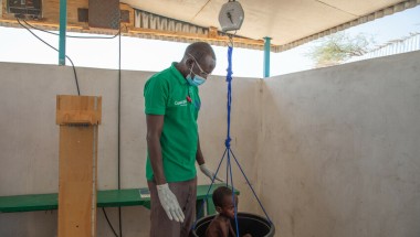 A child is weighed at the Concern health post in Baga Sola, Western Chad. Photo: Eugene Ikua/Concern Worldwide