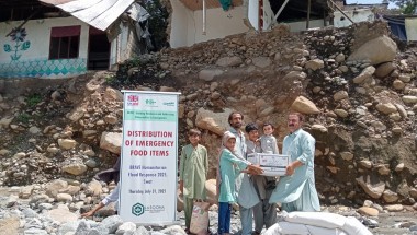 Dry food ration items are distributed to flood affected community members in Pakistan