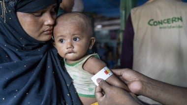 Ayesha*&#039;s malnourished child Anwar* is measured by a Concern health worker in the nutrition center at Camp 13, Cox&#039;s Bazar. (Photo: Saikat Mojumder/Concern Worldwide)