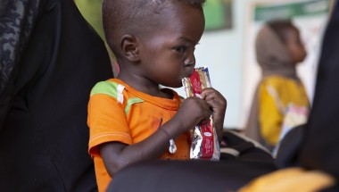 Jamal eats therapeutic food at a nutrition clinic, supported by Concern Worldwide,  in Ardamata, just outside El Geneina, Sudan. Jamal* is severely acutely malnourished.