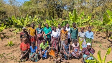 Concern Malawi Team standing with banana sucker recipients in Traditional Authority Ndamera in Nsanje District. Photo: Concern Worldwide.