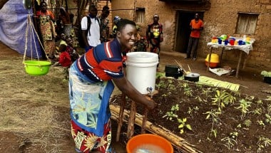 Maman Lumiere (lead mother) demonstrating hand washing in Karusi, Burundi. Photo:  Diane Moyer/Concern Worldwide.