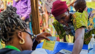 Participants are registered at the verification desk before proceeding to the distribution points. Photo: Samuel Isenge/Concern Worldwide