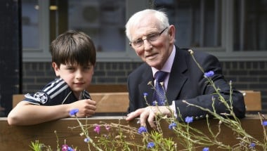 Young boy and Elderly man receive awards for their fundraising efforts 