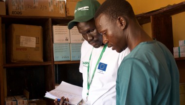 Health and Nutrition Manager Luka Malek Mur and Health Facility Officer checking registers in Northern Bahr al Ghazal, South Sudan. Photo: Hannah Bolder/Concern Worldwide