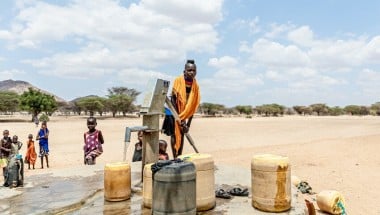 Children pump water at a tap in Kangalita., Kenya. The region has been severely affected by drought. Photo: Natalia Jidovanu/Concern Worldwide.