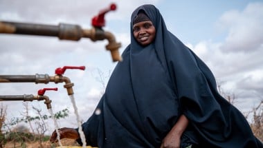 Local farmer Luul Ahmed collecting water at Bula Qalooc, Dolow District, Gedo region, southwestern Somalia