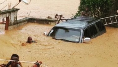 People trapped in heavy floods in Freetown, Sierra Leone in August 2017. 