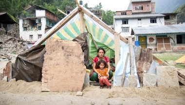 Chameli Darji sits with her youngest daughter, Apita, in their makeshift shelter in Talamarang in Sindhupalchok District, Nepal, one of the hardest hit areas by the 7.8-magnitude earthquake that hit the country on April 25th. Photo taken by Crystal Wells / Concern Worldwide.