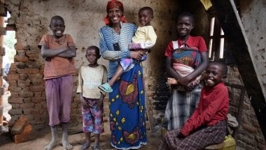 Just a few months after joining Concern’s Graduation programme, Violette Bukeyeneza (pictured here with her family) started a small business selling banana juice. Photo: Darren Vaughan / Concern Worldwide.