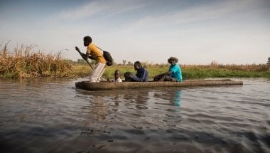 Nile Hope staff travel through the swamps by canoe. Sometimes it can take two days to reach a remote destination. Photo: Kieran McConville / Concern Worldwide