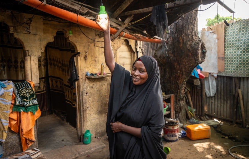 Idil* turning on the solar light she received as part of the Green graduation programme by Concern. (Photo: Mustafa Saeed/Concern Worldwide)