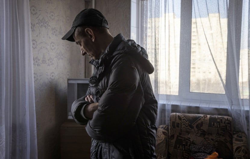 A man looks at the damage in his flat in north eastern Kharkiv due to conflict in the region. (Photo: Ed Ram/Concern Worldwide)