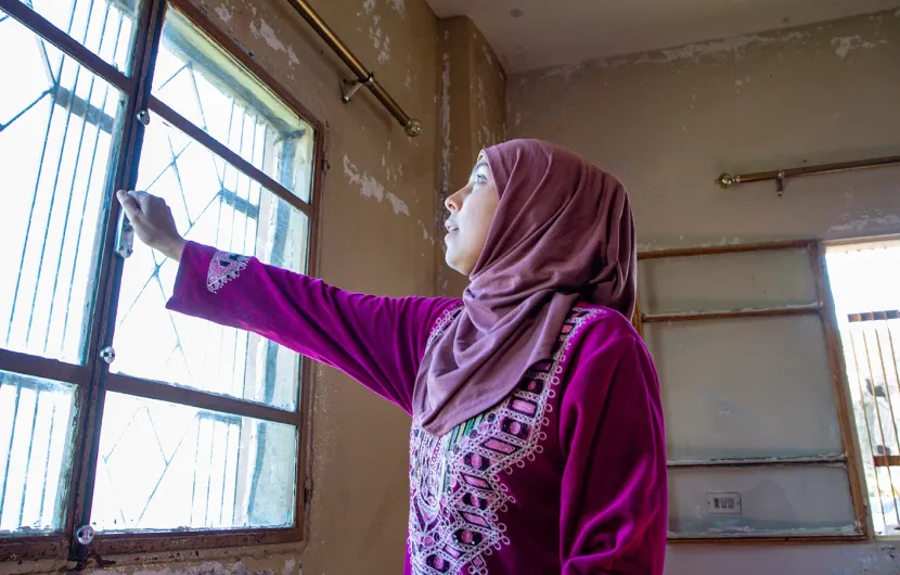 Darine* and her husband want to move where her kids can get an education. Concern has put windows in their apartment to help keep the cold out. (Photo: Gavin Douglas/Concern Worldwide)