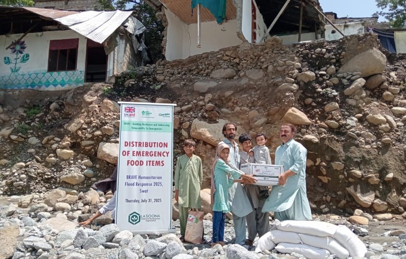 Dry food ration items are distributed to flood affected community members in Pakistan
