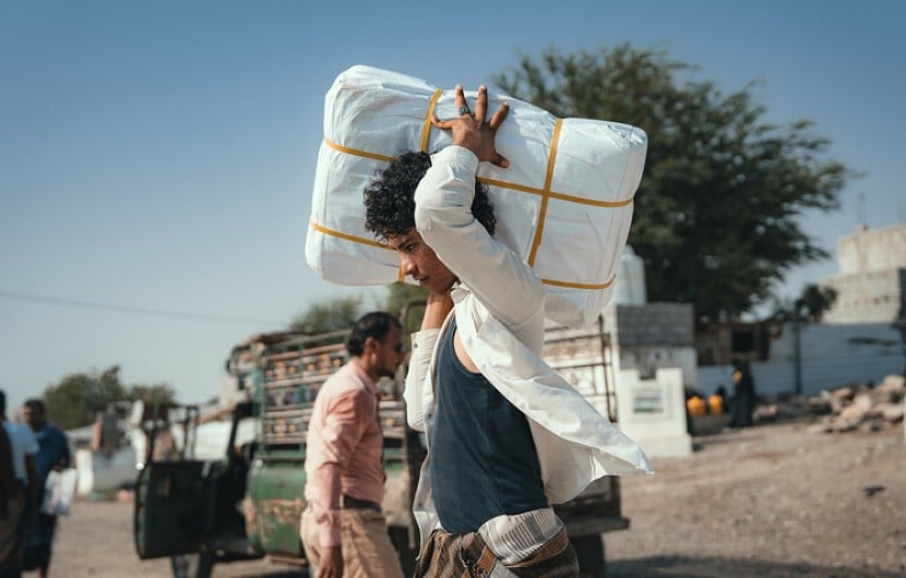 The Concern team distributing shelter materials to people affected by the sandstorm that struck Al Anad IDP Camp, Tuban District, Yemen.