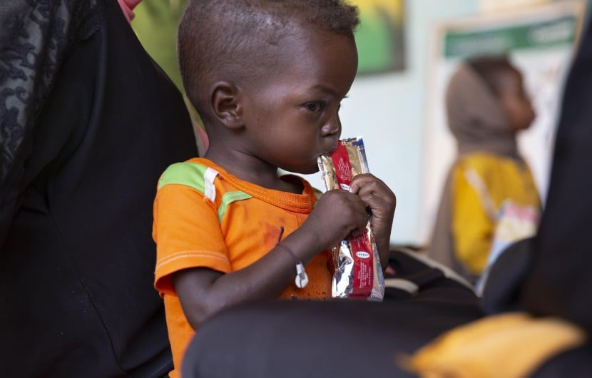 Jamal eats therapeutic food at a nutrition clinic, supported by Concern Worldwide,  in Ardamata, just outside El Geneina, Sudan. Jamal* is severely acutely malnourished.
