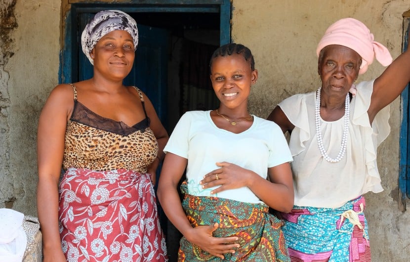 Pregnant mum Safinatu Kamara (22) with her aunt and grandmother at the family home in Mambolo. The health centre that Safinatu is attending for her pregnancy is supported by Concern. Photo: Darren Vaughan/Concern Worldwide
