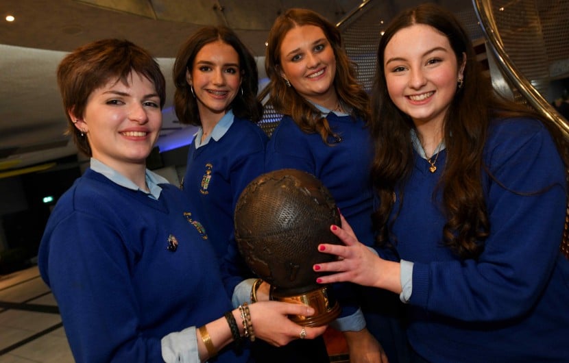 Four people from Ursuline Secondary School holding a trophy after winning Concern Debate final 2026