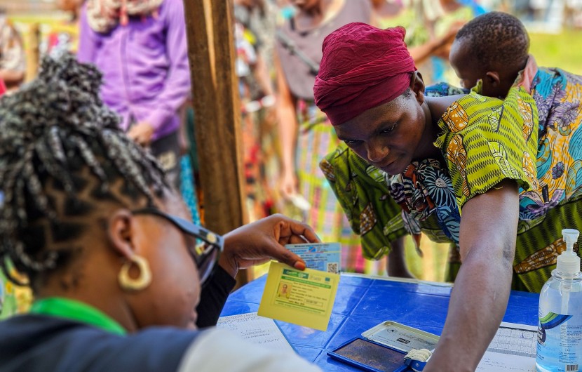 Participants are registered at the verification desk before proceeding to the distribution points. Photo: Samuel Isenge/Concern Worldwide