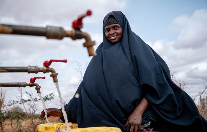Local farmer Luul Ahmed collecting water at Bula Qalooc, Dolow District, Gedo region, southwestern Somalia