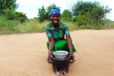 Jennifer, 48, has been able to cook more efficiently and hygienically for her five children in Malawi. Photo: Jason Kennedy / Concern Worldwide