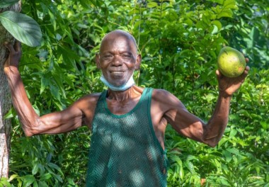 Abraham Gaye (70) showing off his avocado