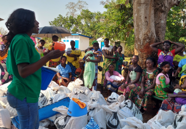 A Concern worker addresses a crowd