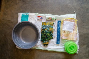 Clothes, a basin, soap and body lotion, fabric, nappies for the child and pads for mums.