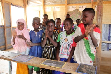 Pupils in class listen attentively