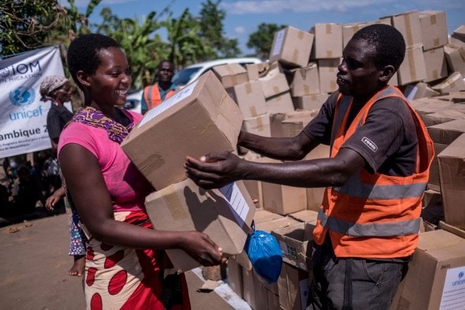 Elina Joao (22) collects supplies from a Concern distribution in Ndeja, Mozambique. They include hygiene kits, kitchen kits, shelter and bedding materials. "These are all the things that we lost in the flood". Photo: Tommy Trenchard / Concern Worldwide
