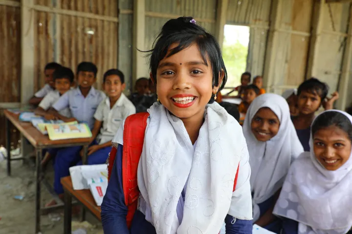 Saliha* (7) attends class at the newly repaired school on one of the Char islands severely affected by recent floods. Photo: Jennifer Nolan / Concern Worldwide. Saliha* (7) attends class at the newly repaired school on one of the Char islands severely affected by recent floods. Photo: Jennifer Nolan / Concern Worldwide.