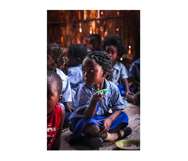 Children in the Community Based Childcare Centre eating their breakfast. Photo: Jennifer Nolan / Concern Worldwide. Children in the Community Based Childcare Centre eating their breakfast. Photo: Jennifer Nolan / Concern Worldwide.