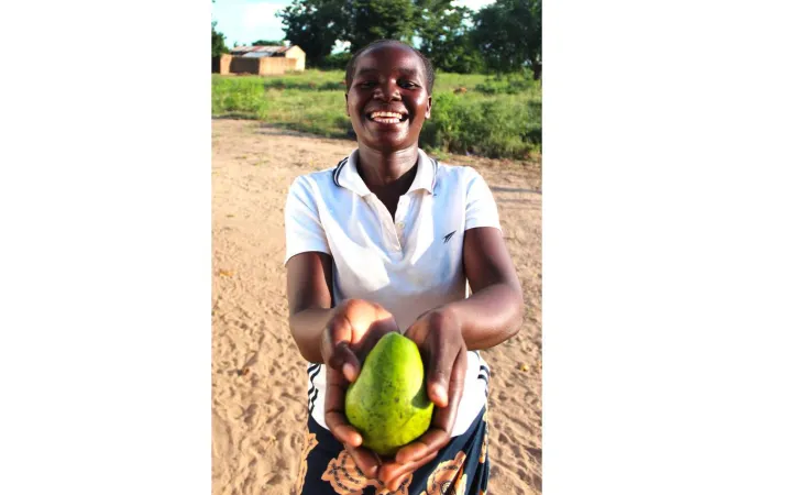 Malita Isaac, 25, shows off one of the avocados she’s grown in Malawi with the support of Concern. Photo: Jason Kennedy /Concern Worldwide Malita Isaac, 25, shows off one of the avocados she’s grown in Malawi with the support of Concern. Photo: Jason Kennedy /Concern Worldwide