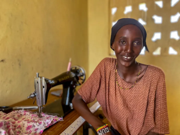 Daro studies tailoring in Northern Kenya with training and equipment provided by Concern. Photo: Jennifer Nolan /Concern Worldwide Daro studies tailoring in Northern Kenya with training and equipment provided by Concern. Photo: Jennifer Nolan /Concern Worldwide
