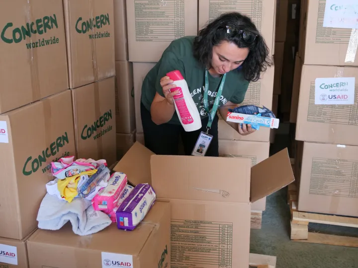 Concern staff check contents of a hygiene kit in a warehouse in Adiyaman, Turkey. 