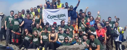 Group of climbers celebrate reaching top of Croagh Patrick