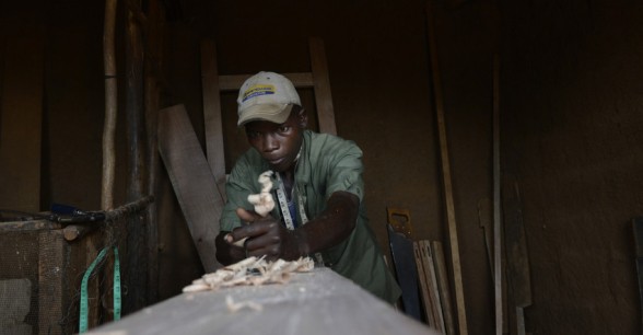 Married father-of-two Daniel Nsabiyaremye (28) started up a bike repair and carpentry business upon completing Concern's graduation programme in Burundi. Photo: Chris de Bode/Panos Pictures for Concern Worldwide.