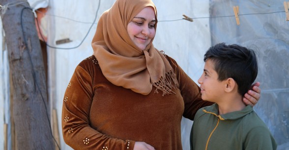 Mona is caring for 11-year-old Bashir after he was orphaned. They are not related but share the same family name. Concern provided a shelter kit to help them resettle. Photo: Darren Vaughan