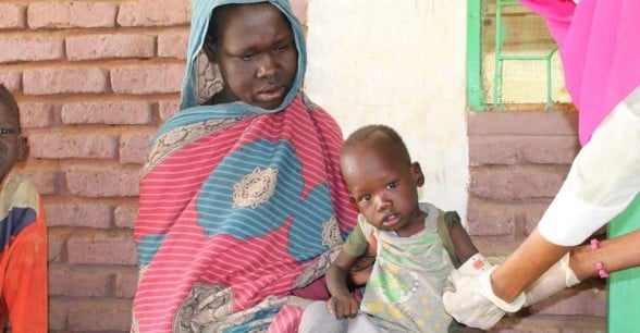 A child is measured for malnutrition in Muglad, West Kordofan.