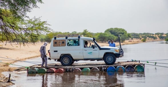 A Concern mobile health clinic rafts across a river to reach remote communities in the Lake Chad region.