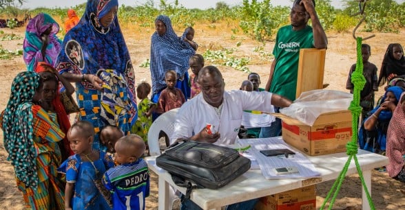 A Concern mobile clinic team in Chad distributes therapeutic food which is used to treat malnutrition.