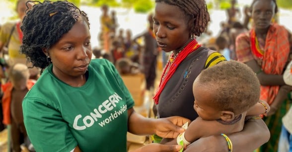 Hella has brought Nyanga to a Concern outreach clinic so that he can receive the supplements that will treat his severe malnutrition.